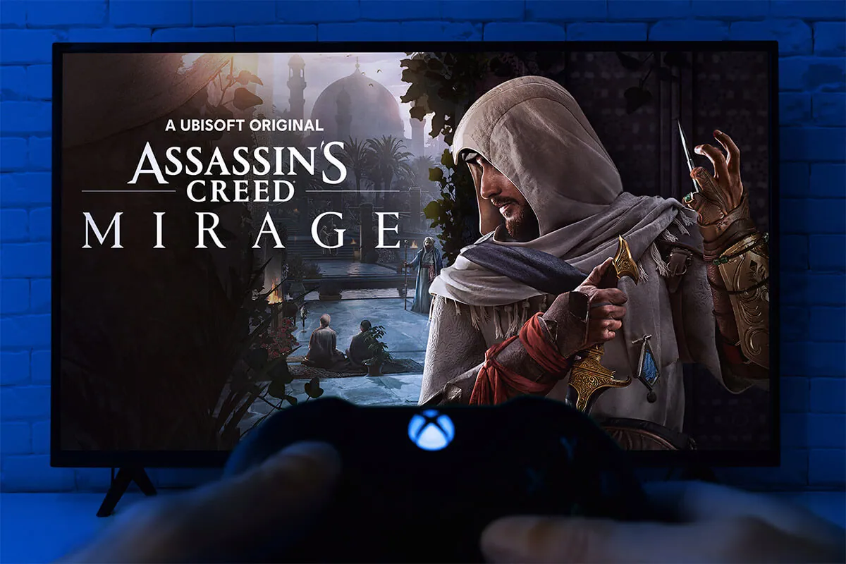 Play Assassins Creed Mirage on TV screen with Xbox controller.