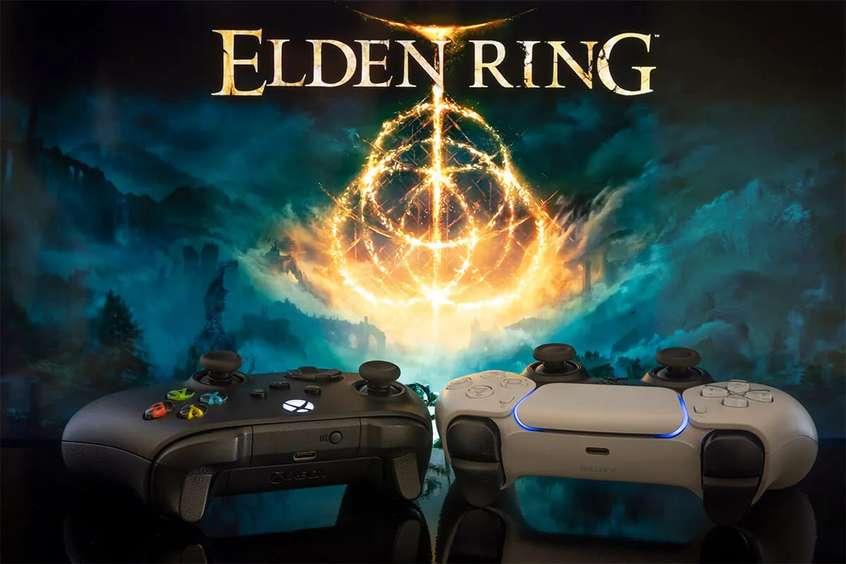 Xbox Series and Playstation 5 controller with Elden Ring at background