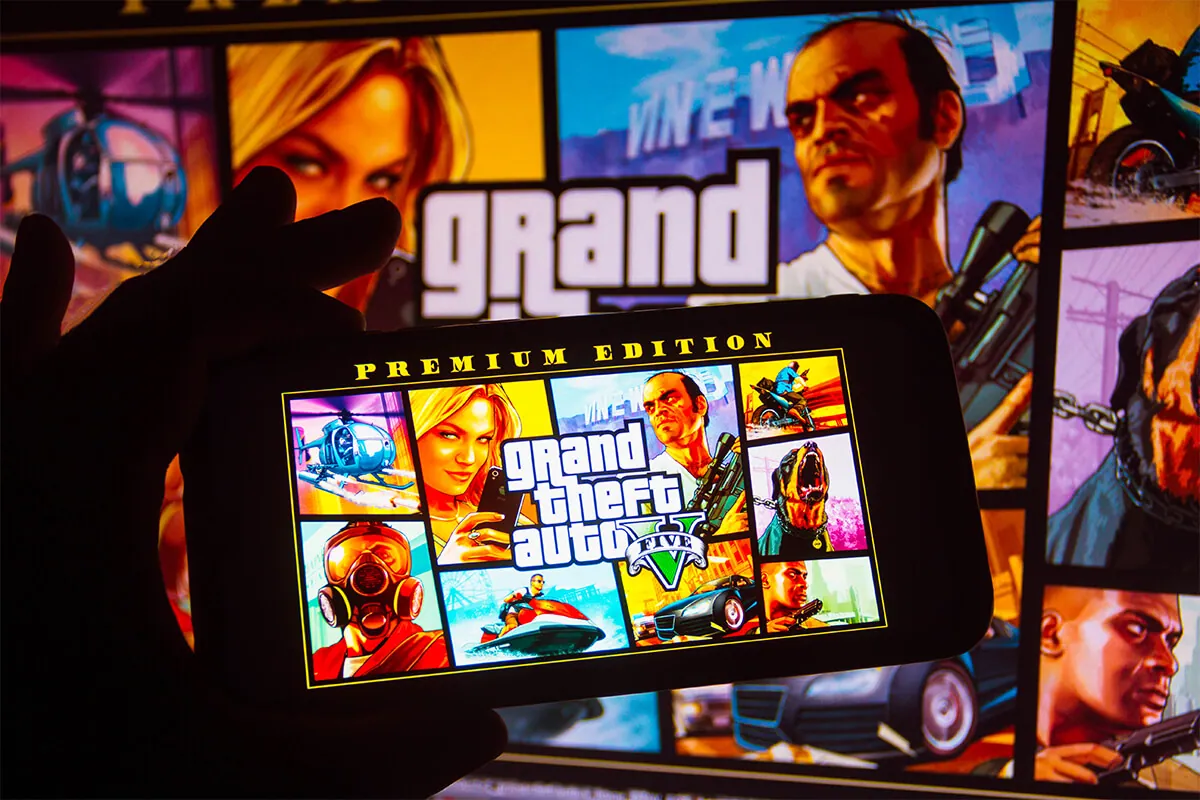 In this photo illustration the Grand Theft Auto (GTA) logo seen displayed on a smartphone.