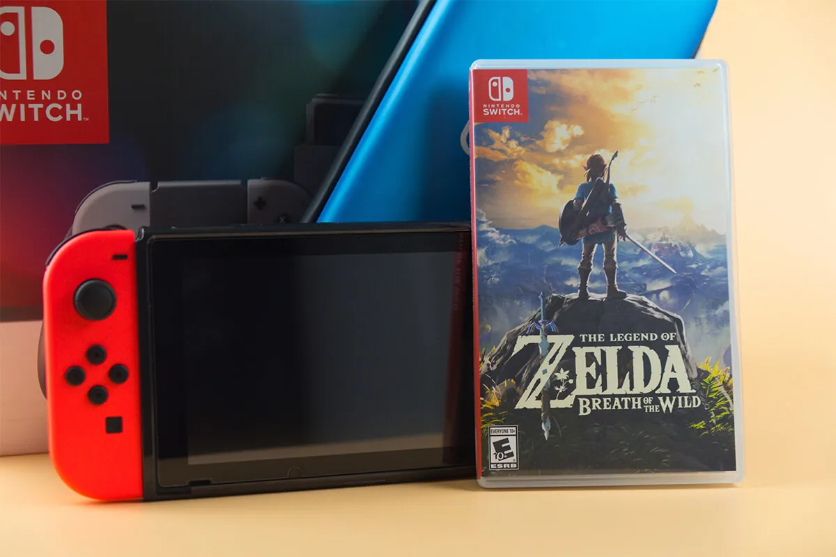Playing The Legend of Zelda on console for home or portable gaming.